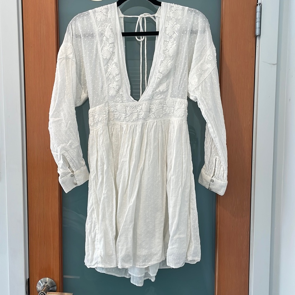 Free People dress. White. Medium size. One tiny stain on sleeve as shown.